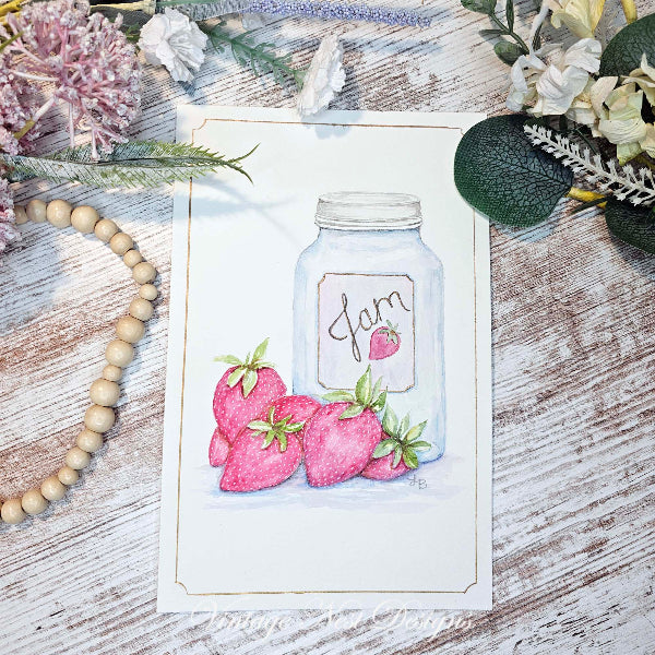 A watercolor art print featuring a glass mason jar labeled 'jam' with pink strawberries, styled on a rustic whitewashed wooden surface with dried flowers, greenery, and a wooden bead garland.